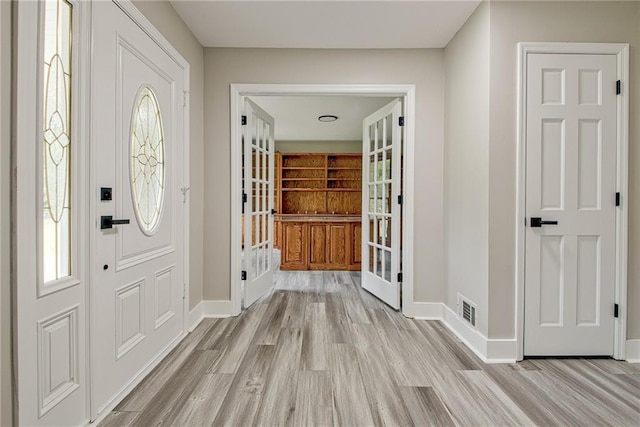 19 Quimby Jackson Rd, Newnan, GA 30263 - foyer entrance featuring light wood finished floors and french doors