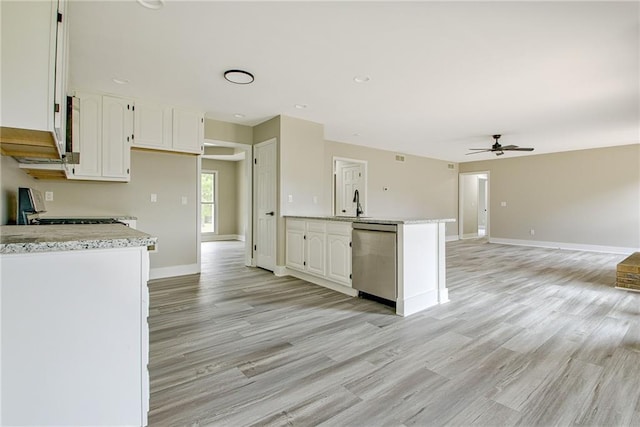 19 Quimby Jackson Rd, Newnan, GA 30263 - kitchen featuring stainless steel dishwasher, ceiling fan, white cabinetry, light wood-type flooring, and stove