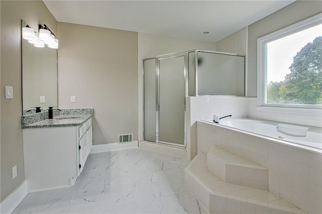 19 Quimby Jackson Rd, Newnan, GA 30263 - full bathroom featuring vanity, a garden tub, a shower stall, and marble look tiles
