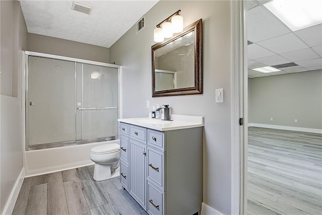 19 Quimby Jackson Rd, Newnan, GA 30263 - full bathroom with wood finished floors, vanity, and shower / bath combination with glass door