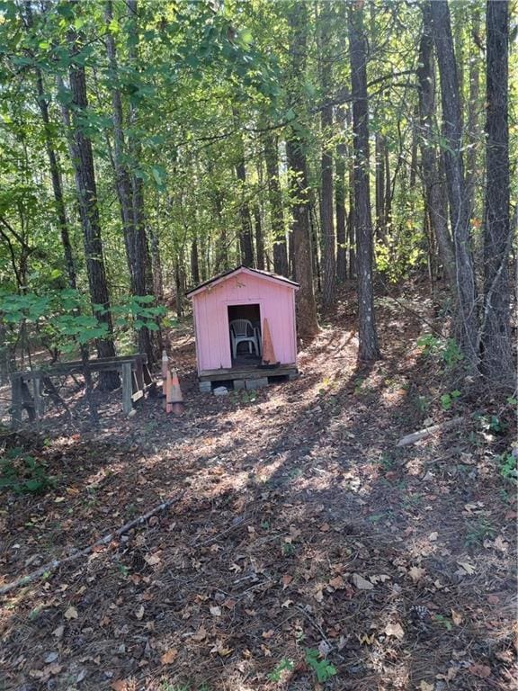 19 Quimby Jackson Rd, Newnan, GA 30263 - view of shed with a view of trees