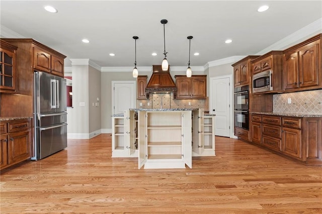 2602 Alcovy Club Dr, Dacula, GA 30019 - kitchen with stainless steel appliances, custom exhaust hood, decorative backsplash, crown molding, and a center island