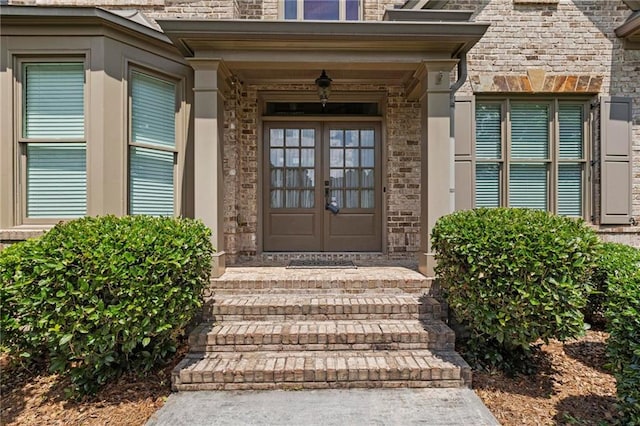 2602 Alcovy Club Dr, Dacula, GA 30019 - property entrance with french doors and stone siding