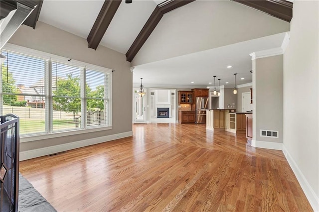 2602 Alcovy Club Dr, Dacula, GA 30019 - unfurnished living room with healthy amount of natural light, light wood-style flooring, recessed lighting, and a fireplace