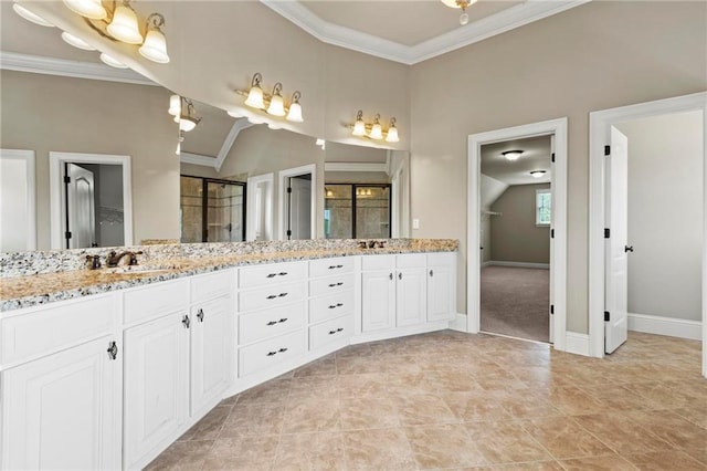 2602 Alcovy Club Dr, Dacula, GA 30019 - bathroom featuring double vanity, crown molding, and a stall shower