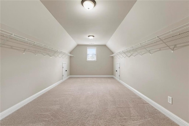 2602 Alcovy Club Dr, Dacula, GA 30019 - walk in closet with lofted ceiling and carpet floors