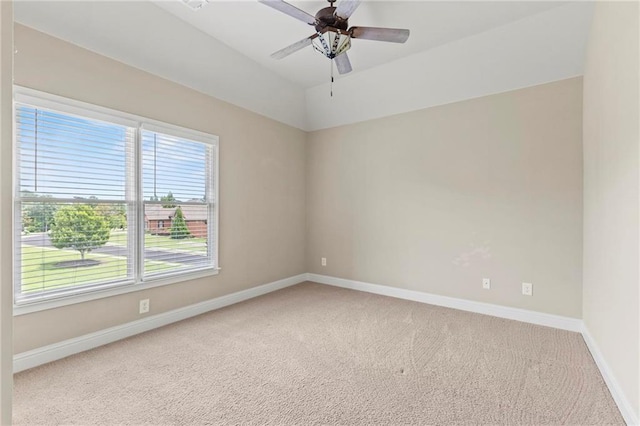 2602 Alcovy Club Dr, Dacula, GA 30019 - empty room featuring light colored carpet, ceiling fan, and vaulted ceiling