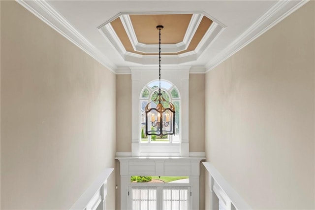 2602 Alcovy Club Dr, Dacula, GA 30019 - stairway with a tray ceiling, crown molding, and a chandelier