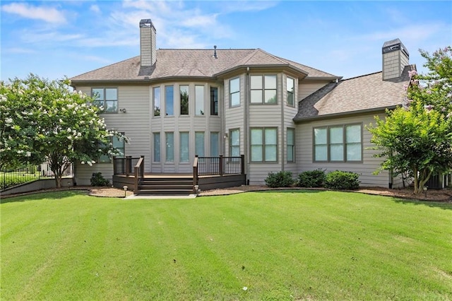 2602 Alcovy Club Dr, Dacula, GA 30019 - back of property featuring a chimney, a deck, and a shingled roof