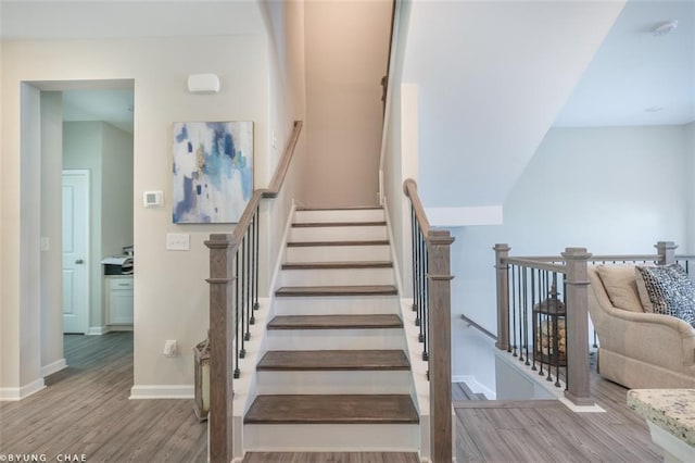2247 Pink Hawthorn Dr, Buford, GA 30518 - staircase featuring wood finished floors and baseboards