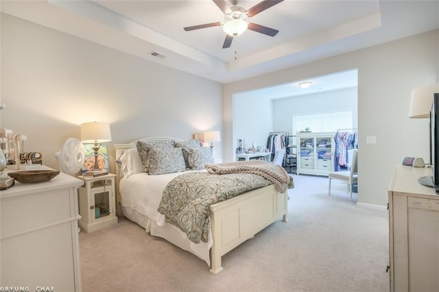 2247 Pink Hawthorn Dr, Buford, GA 30518 - bedroom featuring light carpet, a raised ceiling, and a ceiling fan