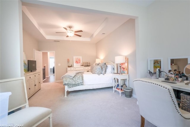 2247 Pink Hawthorn Dr, Buford, GA 30518 - bedroom with light carpet, a tray ceiling, and a ceiling fan