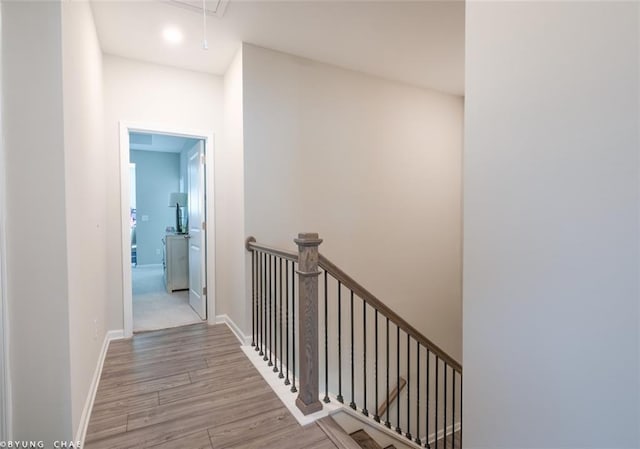 2247 Pink Hawthorn Dr, Buford, GA 30518 - hallway with an upstairs landing, attic access, and wood finished floors