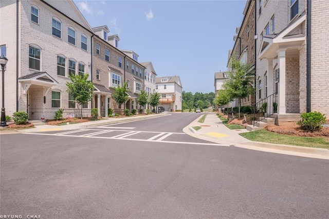 2247 Pink Hawthorn Dr, Buford, GA 30518 - view of asphalt road with sidewalks, a residential view, and curbs