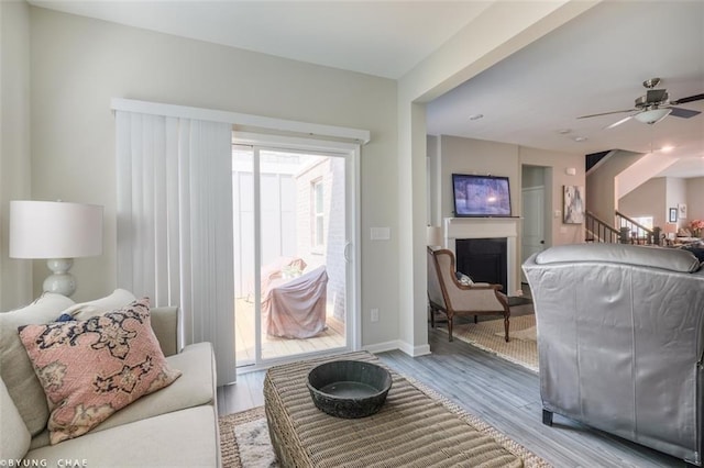 2247 Pink Hawthorn Dr, Buford, GA 30518 - living room with a fireplace, wood finished floors, and ceiling fan