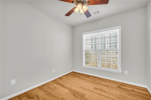 unfurnished room with ceiling fan and hardwood / wood-style floors