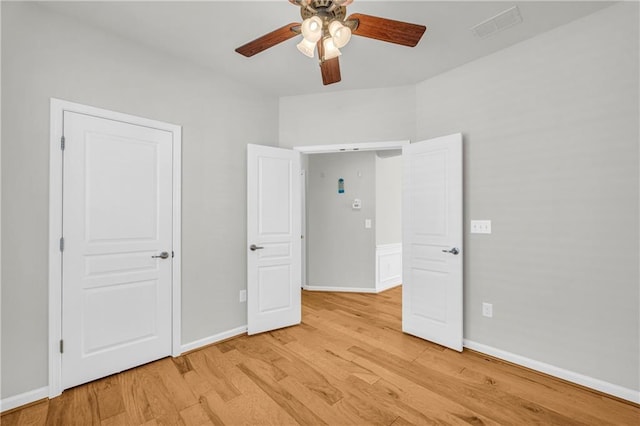 unfurnished bedroom featuring ceiling fan and light wood-type flooring