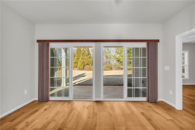 doorway with light hardwood / wood-style flooring