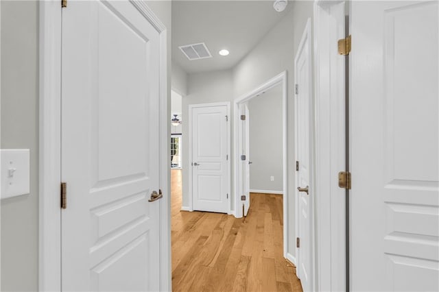 hall with light hardwood / wood-style floors