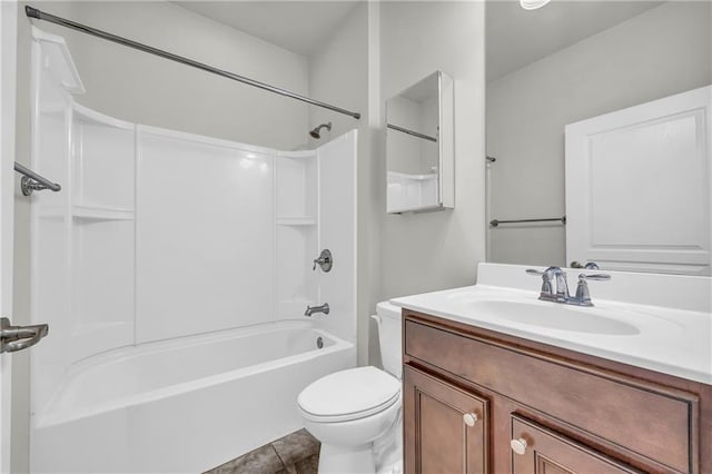 full bathroom featuring vanity, tile patterned floors, toilet, and shower / bath combination