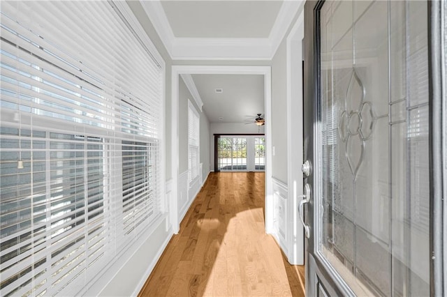 hallway featuring light hardwood / wood-style flooring and ornamental molding