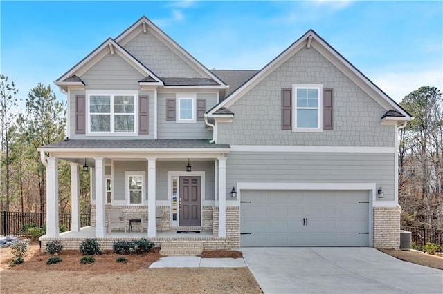 craftsman-style house featuring a garage and covered porch