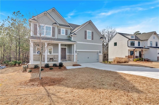 craftsman inspired home featuring a porch, a garage, and a front lawn