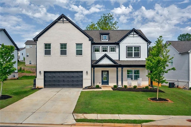 view of front facade featuring an attached garage, driveway, a front lawn, and board and batten siding