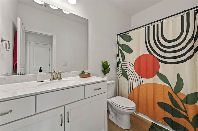 full bathroom with toilet, vanity, wood finished floors, and a shower with shower curtain