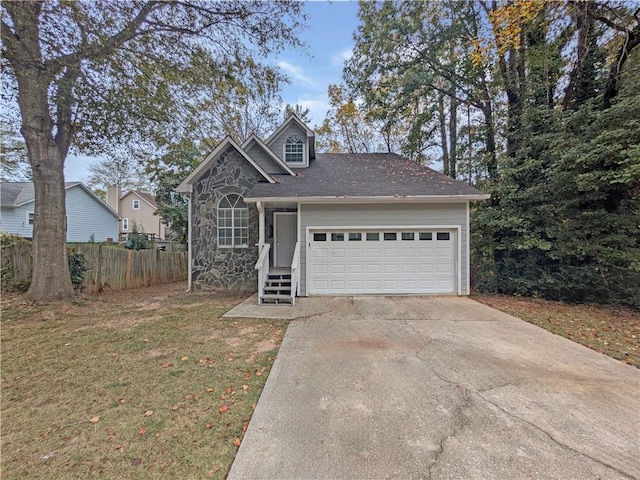 view of front property with a front lawn and a garage