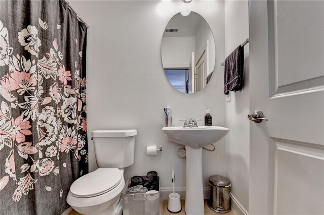 bathroom with toilet and sink