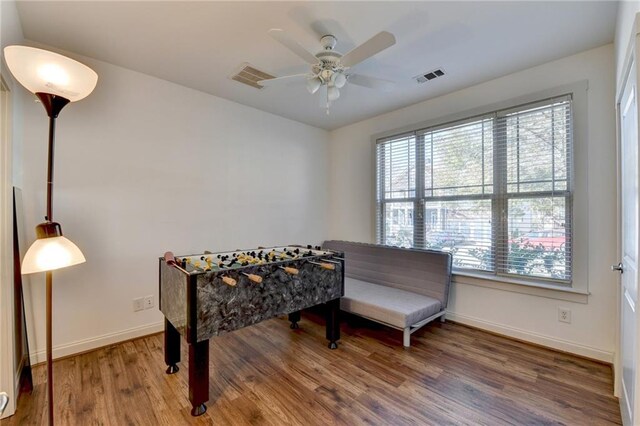 game room with ceiling fan and hardwood / wood-style flooring