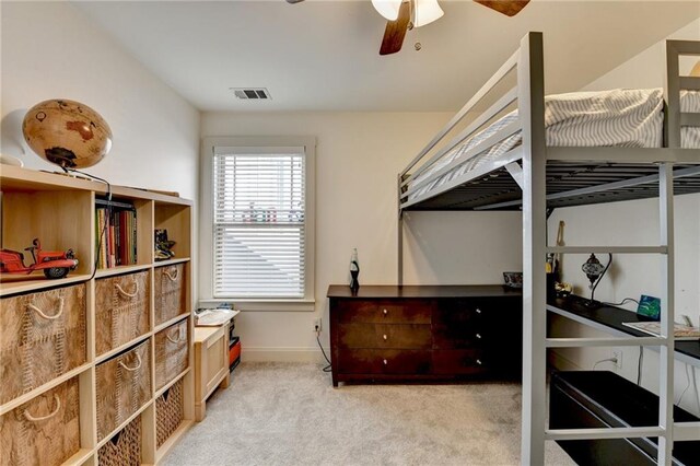 bedroom with light carpet and ceiling fan