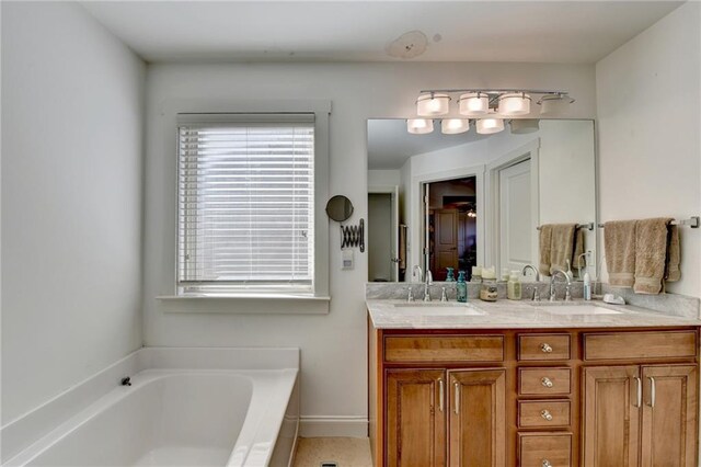 bathroom featuring a bathtub and vanity