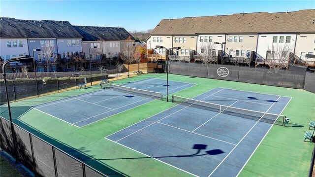 view of sport court with basketball hoop