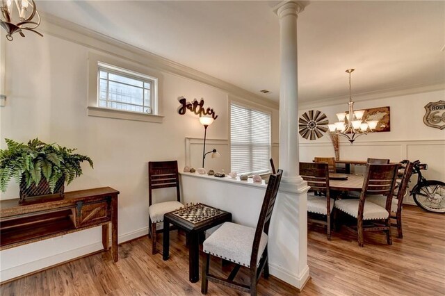 sitting room featuring hardwood / wood-style floors, plenty of natural light, and a notable chandelier