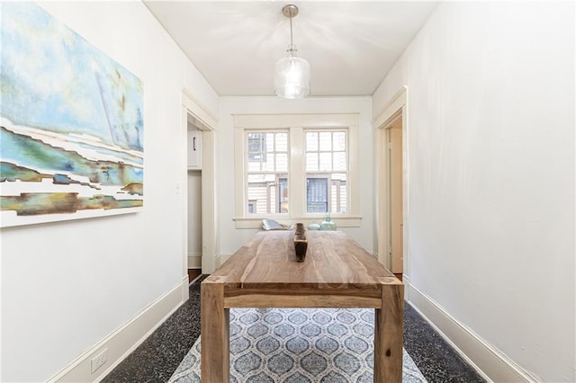 dining room featuring baseboards