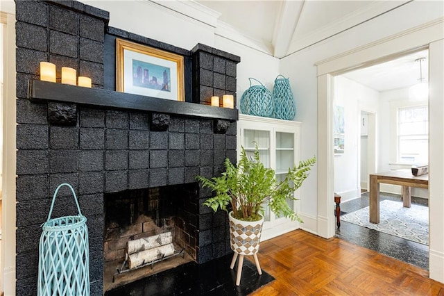 interior details featuring a brick fireplace and baseboards