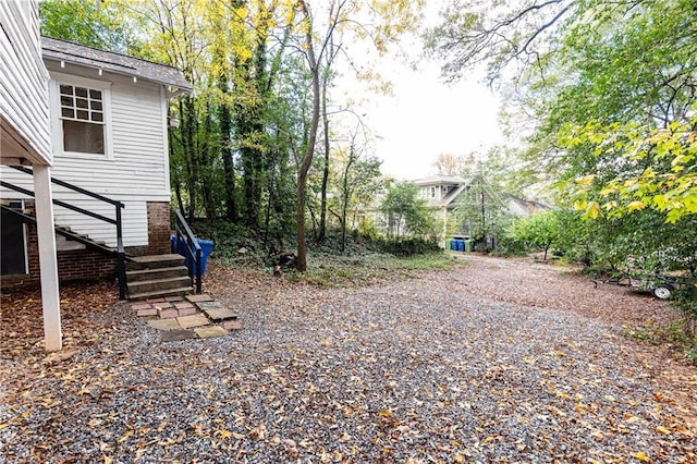 view of yard featuring stairs