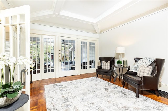 sitting room featuring french doors and ornamental molding