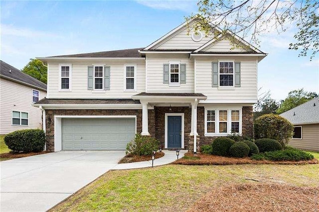 316 Branch Valley Dr NE, Dallas, GA 30132 - view of front of house with stone siding, an attached garage, concrete driveway, and a front lawn