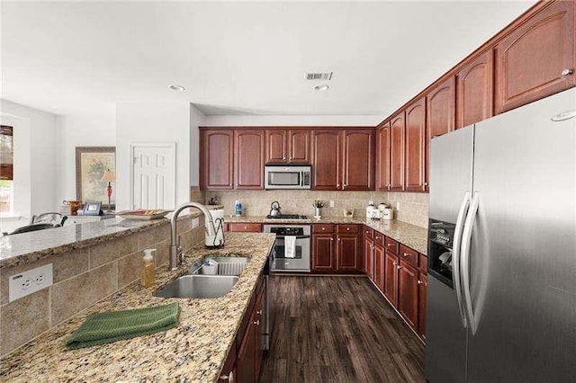 316 Branch Valley Dr NE, Dallas, GA 30132 - kitchen with appliances with stainless steel finishes, a sink, light stone countertops, backsplash, and recessed lighting