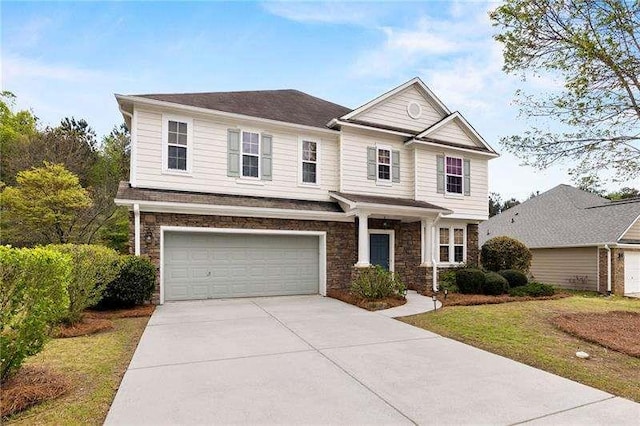 316 Branch Valley Dr NE, Dallas, GA 30132 - view of front of home with stone siding, concrete driveway, a garage, and a front yard