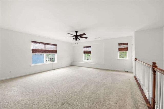 316 Branch Valley Dr NE, Dallas, GA 30132 - spare room featuring plenty of natural light, ceiling fan, and baseboards