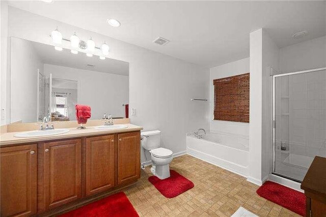316 Branch Valley Dr NE, Dallas, GA 30132 - full bathroom featuring a bath, double vanity, a stall shower, toilet, and baseboards