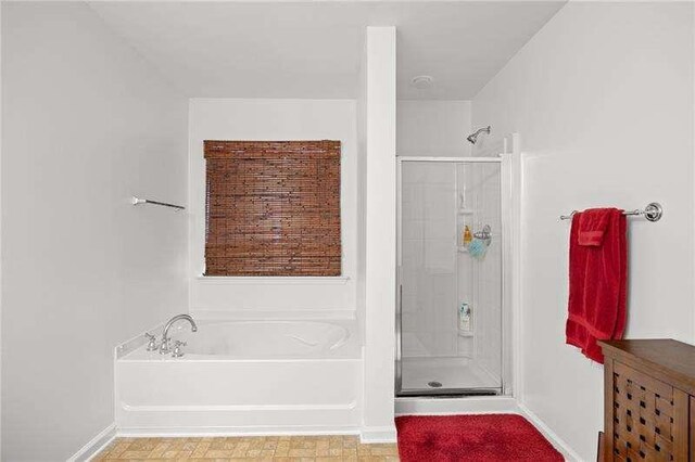 316 Branch Valley Dr NE, Dallas, GA 30132 - bathroom with a stall shower and a bath