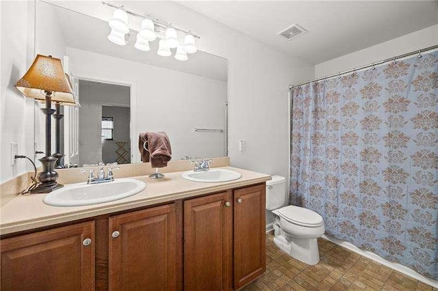 316 Branch Valley Dr NE, Dallas, GA 30132 - bathroom with toilet, double vanity, and curtained shower