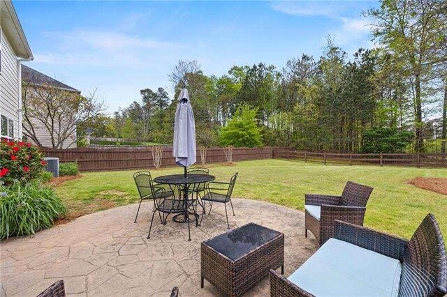 316 Branch Valley Dr NE, Dallas, GA 30132 - view of patio featuring outdoor dining space and central AC