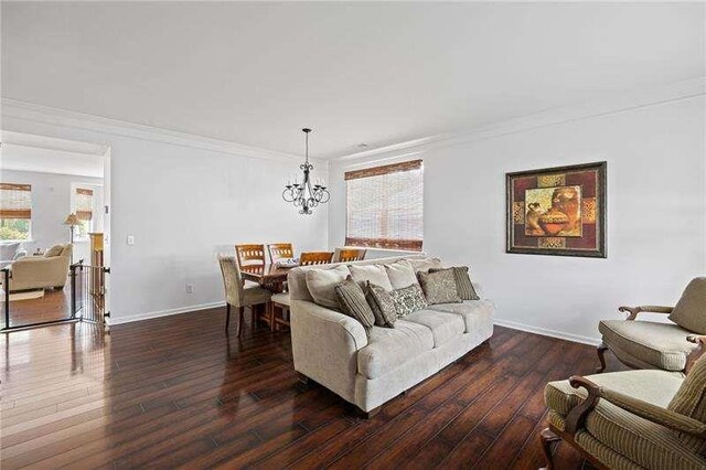 316 Branch Valley Dr NE, Dallas, GA 30132 - living area with a chandelier, ornamental molding, baseboards, and wood finished floors