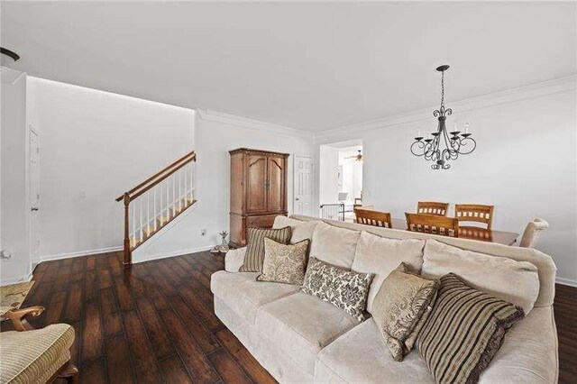 316 Branch Valley Dr NE, Dallas, GA 30132 - living room featuring stairs, a chandelier, hardwood / wood-style flooring, ornamental molding, and baseboards